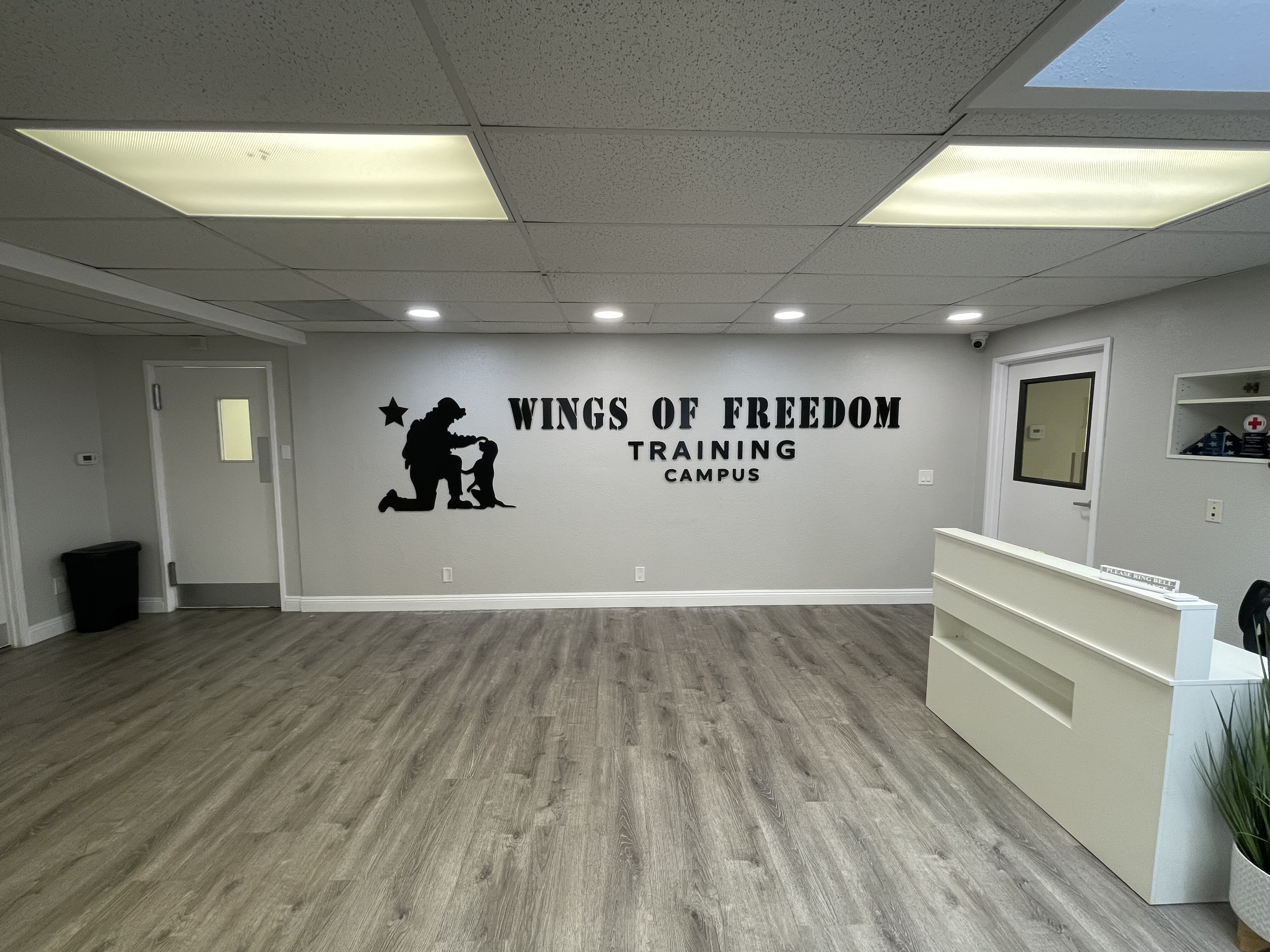 Wings of Freedom Training Campus indoor lettering sign